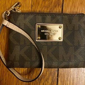 Small Michael Michael Kors wristlet. Has 3 credit card slots. Used once